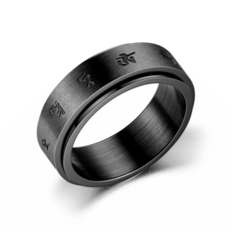 Sleek black ring with subtle engraved symbols, shown on a woven leather background.
